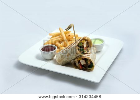 A Low Contrast Hero Shot Of A Chicken Pimiento Sandwich With Samurai & Alger Sauce & Fries On The Si