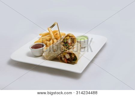 A Low Contrast Hero Shot Of A Chicken Pimiento Sandwich With Samurai & Alger Sauce & Fries On The Si