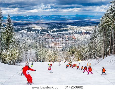 Ski Slope With People Practicing Ski In Poiana Brasov, Romania