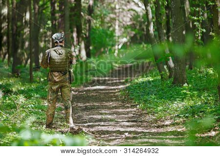 Airsoft Soldier Player Waiting On The Road On Block Post