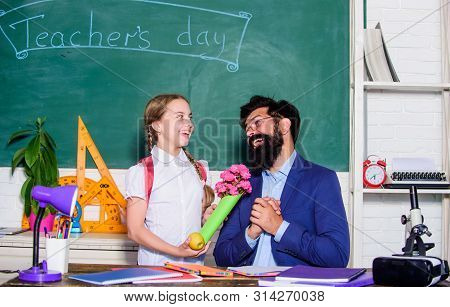 Flower Present For Best Teacher. Teachers Day. Daugghter And Father With Flowers. Back To School. Ha