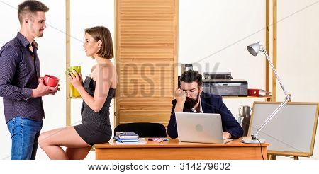 Rest Break At Work. Business Partners Enjoying Conversation In Lunch Break While Colleague Working I