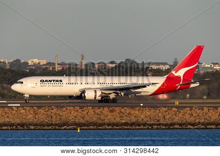 Sydney, Australia - October 9, 2013: Qantas Boeing 767 Airliner Landing At Sydney Airport.