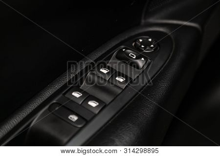 Novosibirsk, Russia - July 09, 2019: Citroen C4, Close-up Of The Side Door Buttons: Window Adjustmen