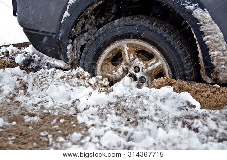 Car Wheel Is Deeply Stuck In The Sand. Car Wheel Is Deeply Stuck.