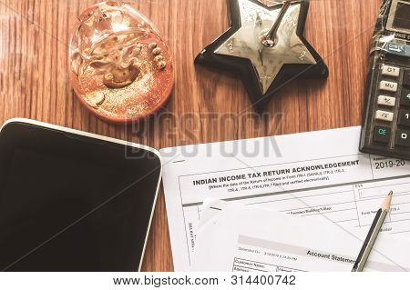 Close Up Of Indian Income Tax Return Form Itr-2 Return Form Is On The Table Next To A Pen, Calculato