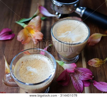 Capuccino Coffee Made By Barista With Flower Decoration