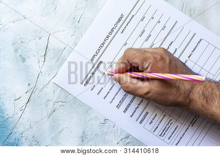 Hand Filling Standard Application For Employment. Hr, Hiring, Applicant Filling Job Application. Hr,