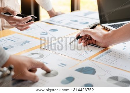Business People Meeting To Analyse And Discuss And Brainstorming The Financial Report Chart Data In 