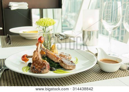 A Delicious Lamb Steak With Spinash Background;