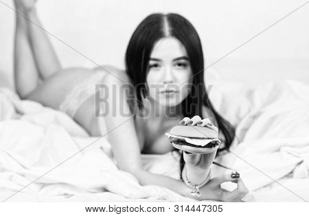 Girl In Sexy Lingerie Eat Burger. Sexual Appetite. Food Delivery Service. Seductive Sexy Woman Relax