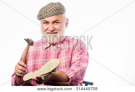 Cobbler Workmanship. Shoemaker Working With Leather Textile And Hammer At Workshop. Shoemaker At Wor