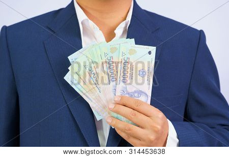 Money In Vietnam Hold On Hand Business Man Wearing A Blue Suit (socialist Republic Of Vietnam), Dong
