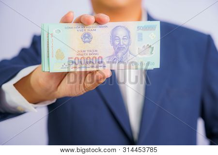 Money In Vietnam Hold On Hand Business Man Wearing A Blue Suit (socialist Republic Of Vietnam), Dong