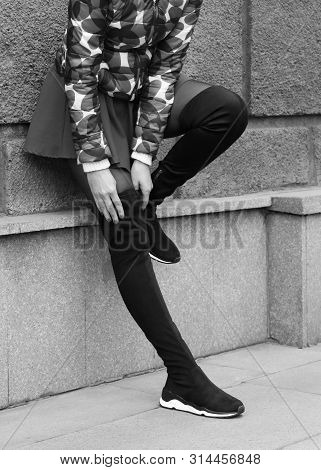Girl In High Stockings Jackboots. Girl In Boots On The Street. Hessian Boots On Sports Soles.