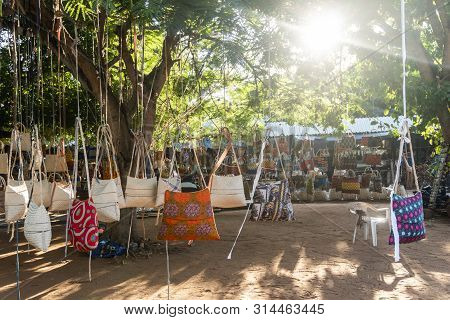 Traditional African Market Selling Colorful  Bags Hanged On Trees, Maputo, Mozambique