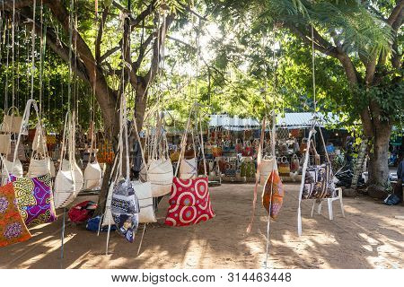 Traditional African Market Selling Colorful  Bags Hanged On Trees, Maputo, Mozambique