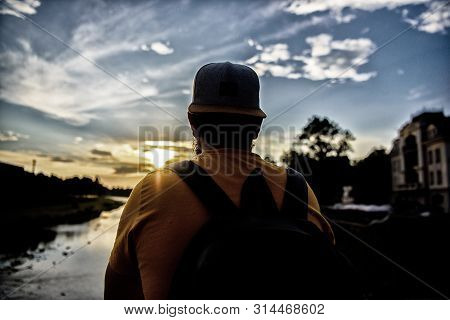 Guy In Front Of Blue Sky At Evening Time Admire Landscape. Enjoy Pleasant Moment. Take Moment To Adm