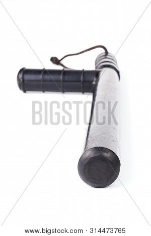 Black Classic Rubber Police Tonfa Baton Isolated On White Background With Selective Focus And Wide A