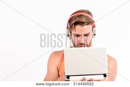Searching For Favorite Music. Sexy Muscular Man Listen Audio. Man In Earphones Isolated On White. E 