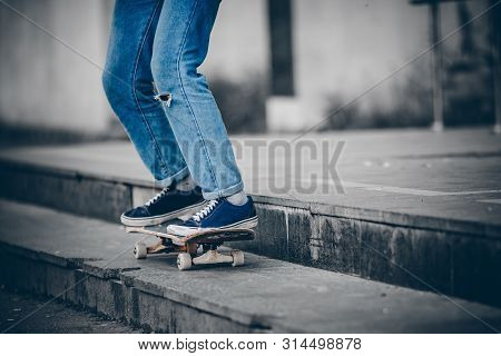 Skateboard Man In Shoes And Jeans Getting Ready To Jump Kickflip Olli From Steps