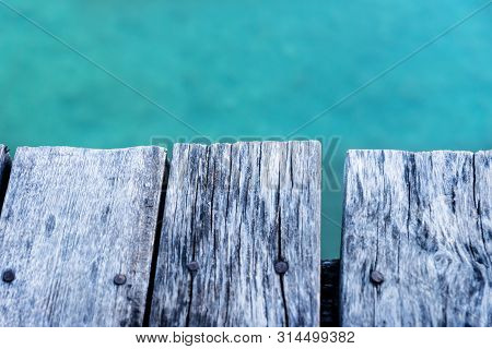 Detail Of A Rustic Wooden Dock With Turquoise Water Of The Lake, El Remate, Guatemala