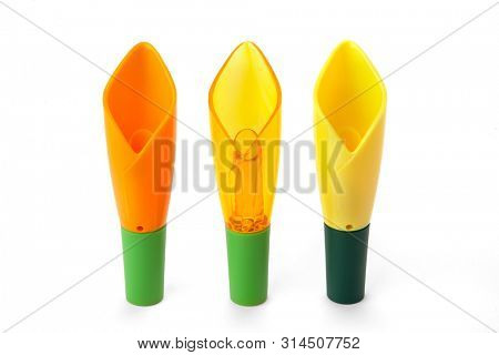 Multicolor wine pourer and wine stopper on white background
