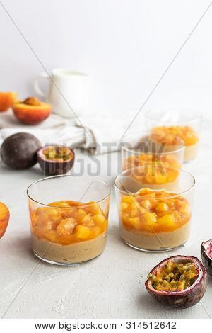 Caramel Panna Cotta, Custard Pudding With Peach And Passion Fruit, White Table, Copy Space