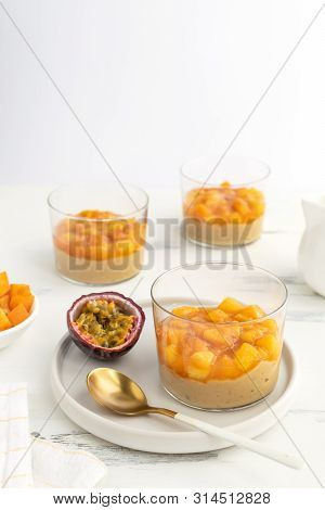 Caramel Panna Cotta, Custard Pudding With Peach And Passion Fruit, White Table, Copy Space