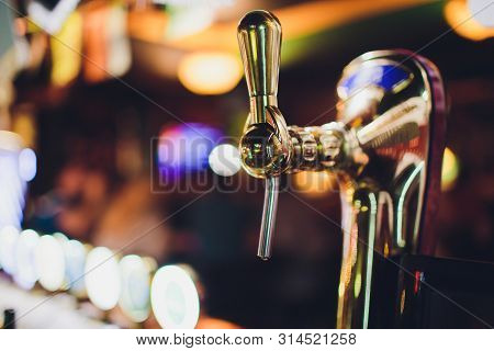 Close Up Of Beer Taps In Row. Metallic Equipment For Bars And Mini Brewerys. Concept Of Modern Equip