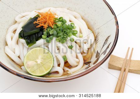 Japanese Bukkake Udon Noodles In A Ceramic Bowl On White Background