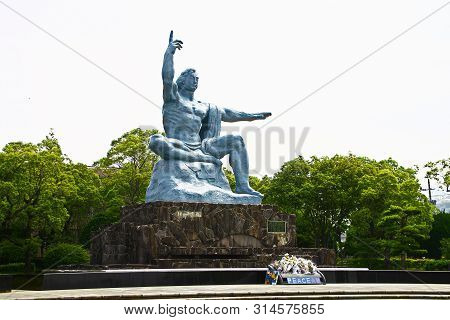 Nagasaki, Japan - 25 May 2013, Peace Park With Peace Statue. The Statue Is Commemorating The Atomic 