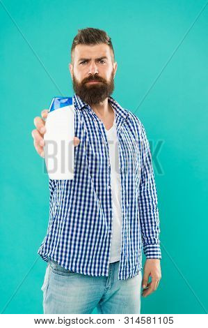 Hair Care. Shampoo For Daily Use. Body Care Cosmetic Bath Shower. Man Hold Shampoo Bottle. Shampoo A