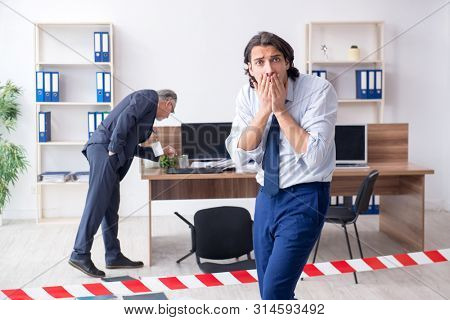 Forensic investigator investigating theft in the office