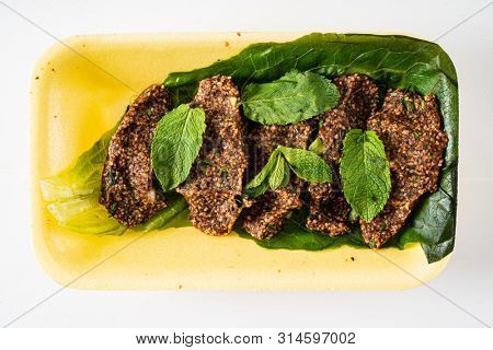 traditional Turkish cutlets (Ãi? kÃ¶fte) 