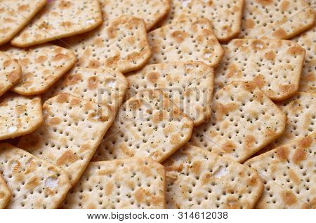 Tuc Original Snack Crackers Lies On Market Table Stacked In Big Pile