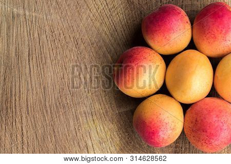 Apricot Fruit. Fresh Apricots On A Wooden Background. Close Up