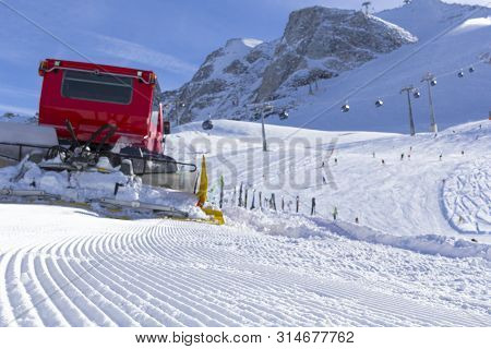 Snowplow Clears Tracks In The Ski Resort Of The Hintertuxer In Tyrol, Austria