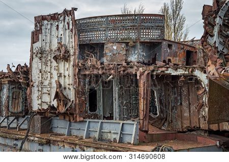 Huge Rusty Pieces Of Decommissioned Marine Ship That Was Cut And Left On The Shore.