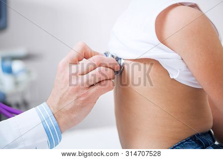 Pediatrician Examining Little Child With Stethoscope. Medical Examination Of Little Girl. Profession