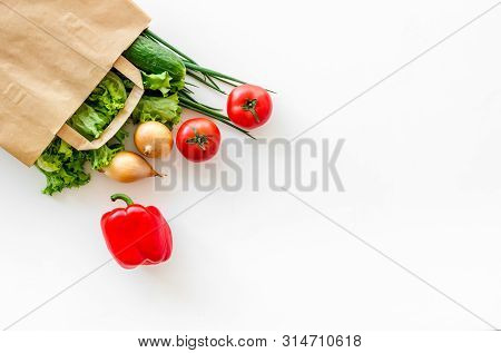 Healthy Food With Fresh Vegetables In Paper Bag On White Background Top View Space For Text