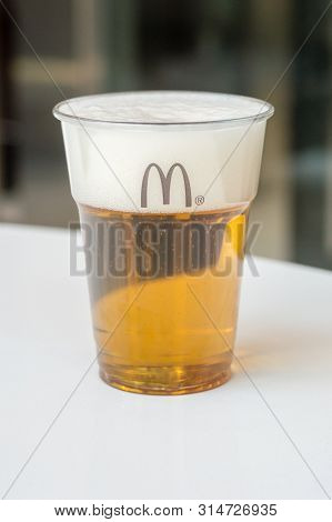 Andorra, Andorra - June 3, 2019: Mahou Beer In A Plastic Cup In Mcdonald Restaurant.