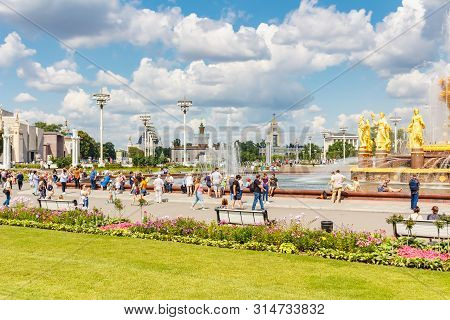 Moscow, Russia - July 22, 2019: People Resting On Benches And By Fountain Friendship Of Peoples In V
