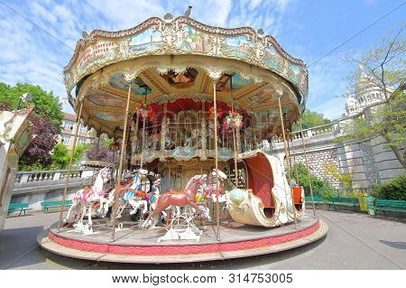 Paris France - May 24, 2019: Old Merry Go Round Amusement Park In Willette Square Park Montmartre Pa