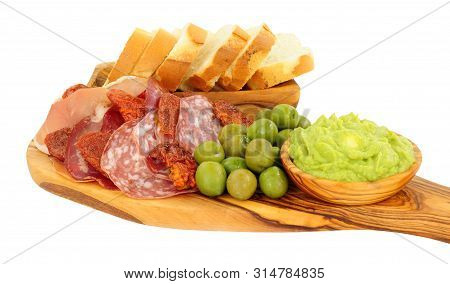 Gran Antipasto Snack Selection On An Olive Wood Serving Board With Salami, Cured Meat Slices And A B