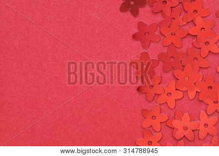 Red Palettes In The Form Of Flowers On A Red Background, A Festive Concept.  Place For Text.