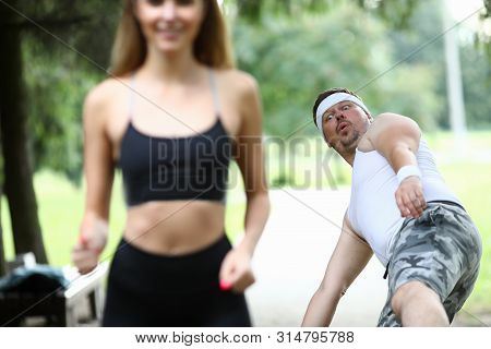 Horny Male With Stupid Face Stumbled And Lost Balance Watching Hot Young Smiling Female Running In P