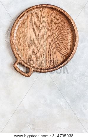 Empty Round Wooden Dish On Grey Concrete Background, Copy Space For Your Text