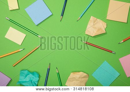 Top View Of Scattered Pencils And Paper With Empty Space In , Iddle