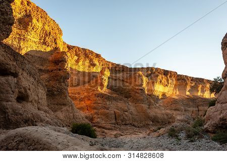 The Walls Of Sesriem Canyon, Nambia, Illuminated By The Golden Hour Of The Setting Sun.